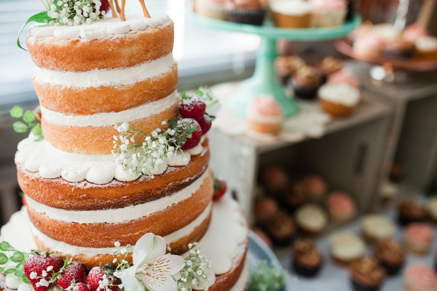 Naked Wedding Cake with Srawberries - Dessert table photo